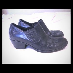 Born • black leather embroidered clogs